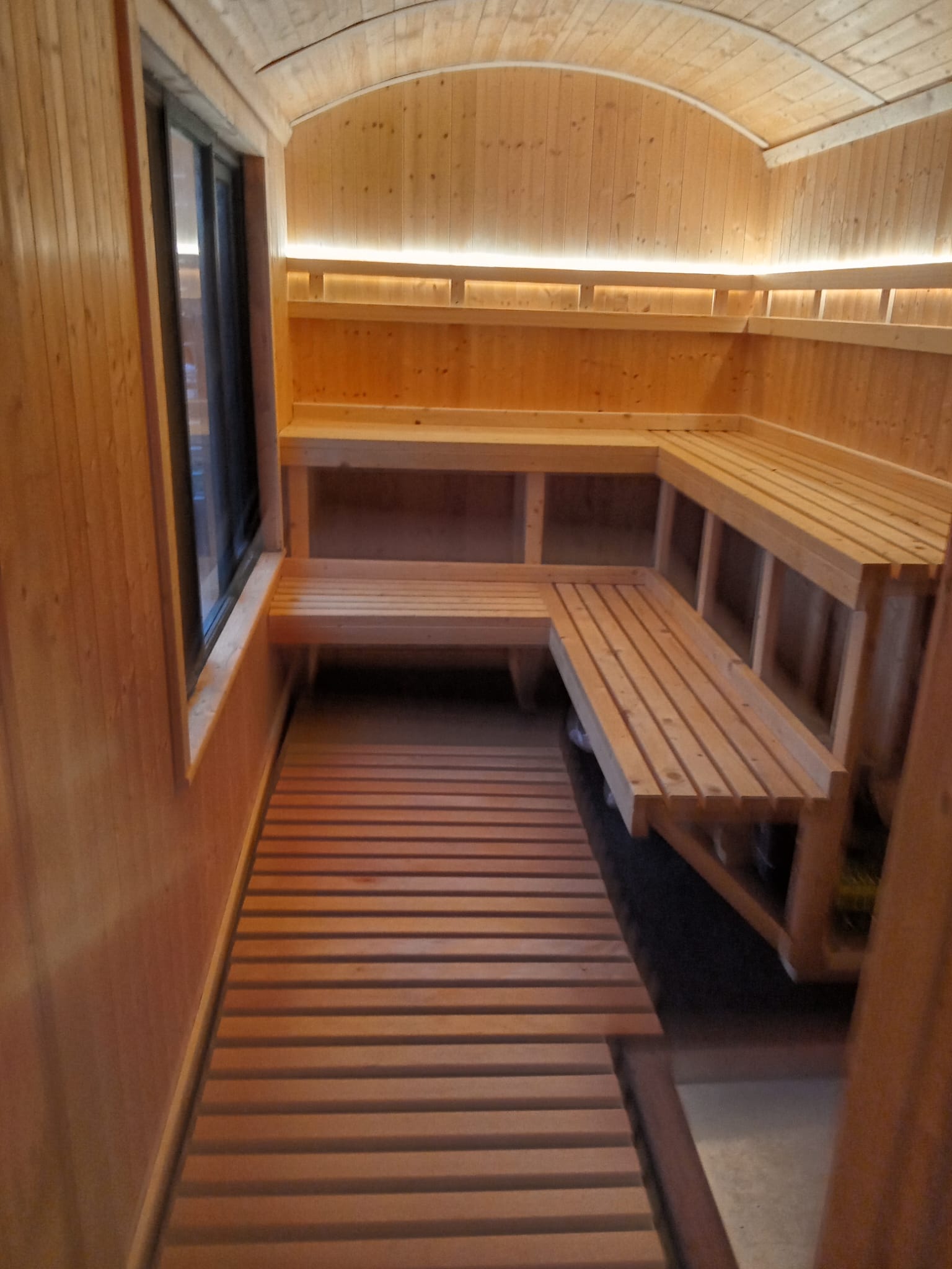 Warm timber benches inside the OG Sauna Co sauna